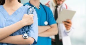 doctor working in hospital with other doctors.